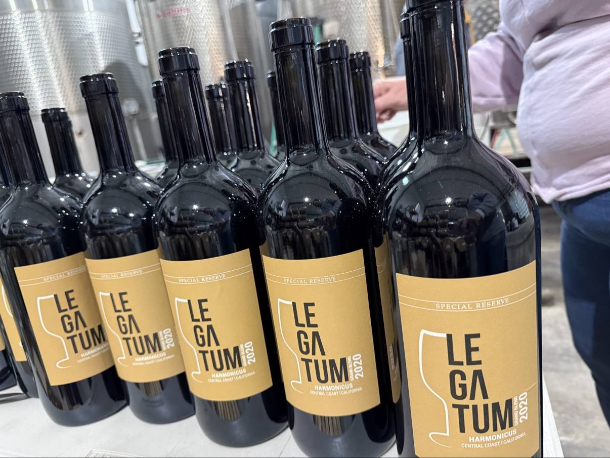 A lineup of finished Legatum 2020 Harmonicus bottles at the winery