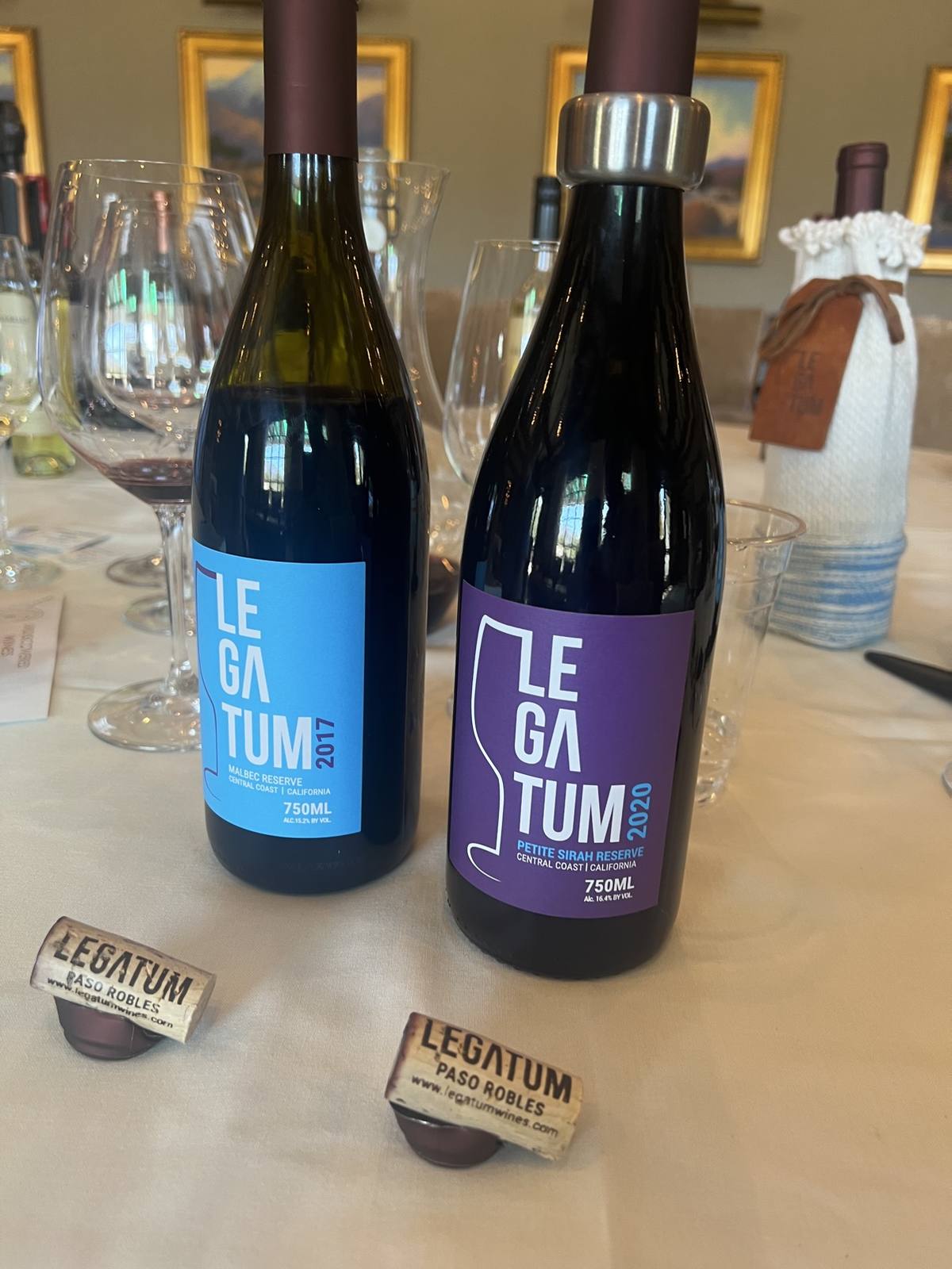 Blue-label 2017 Malbec Reserve beside purple-label 2020 Petite Sirah Reserve