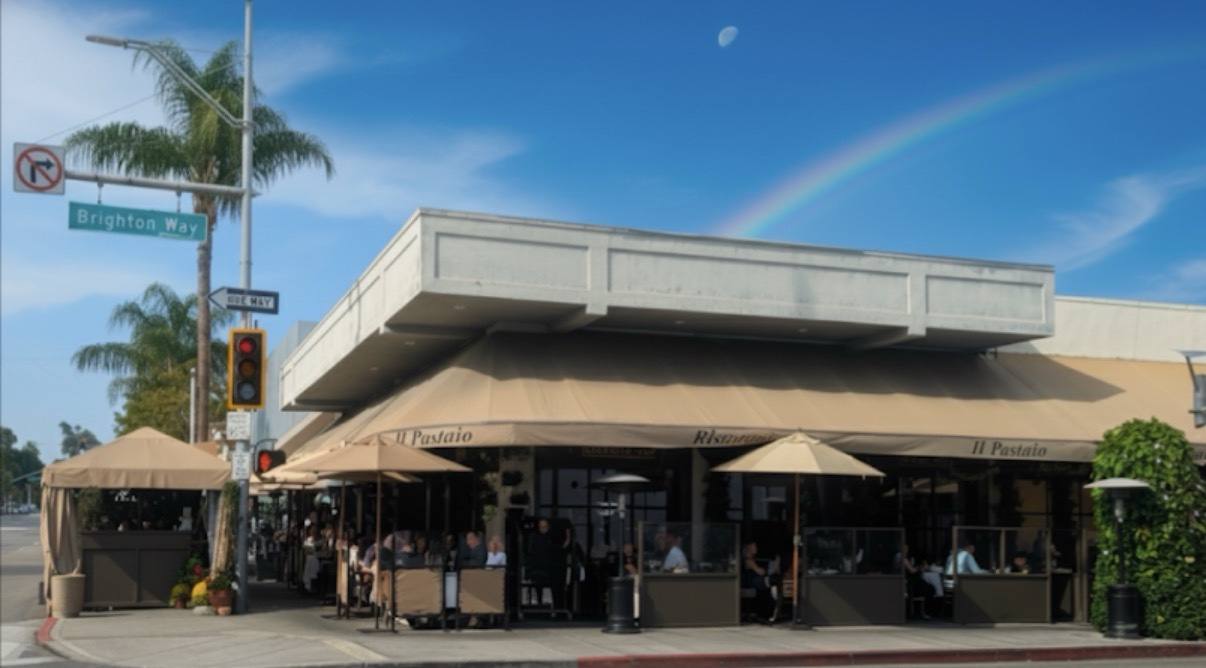 Il Pastaio restaurant exterior on Brighton Way in Beverly Hills beneath a rainbow