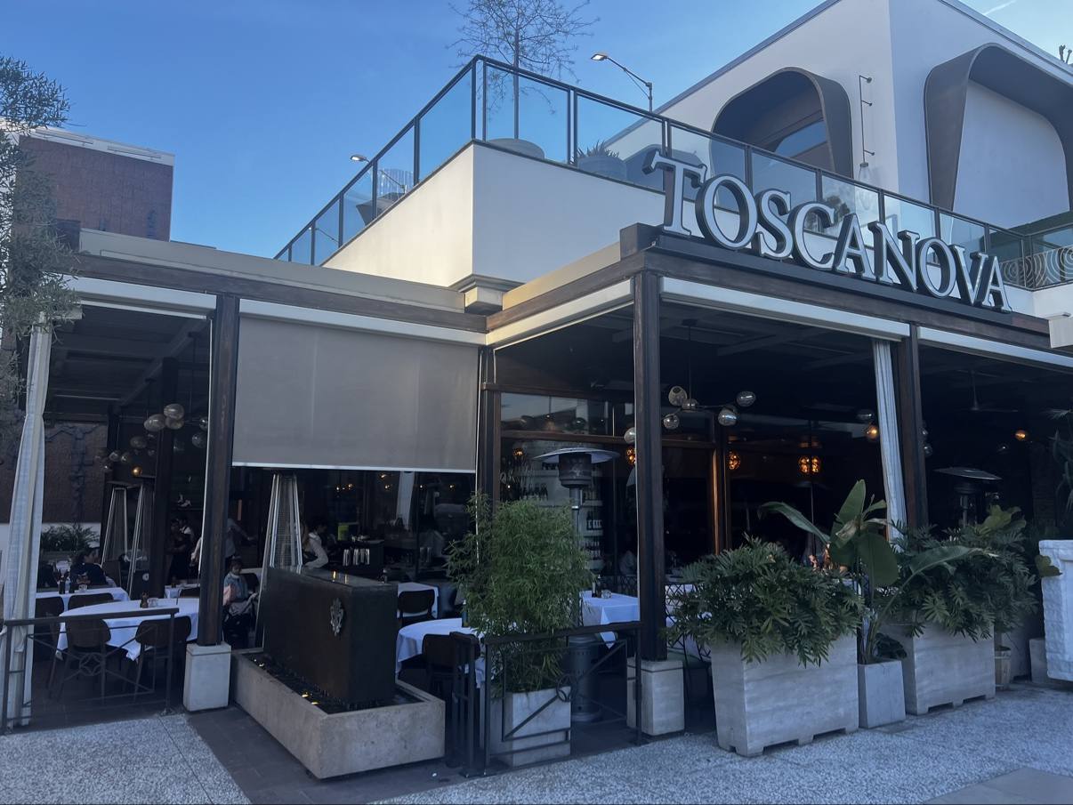 Toscanova’s open-air Italian restaurant exterior beneath a clear blue sky