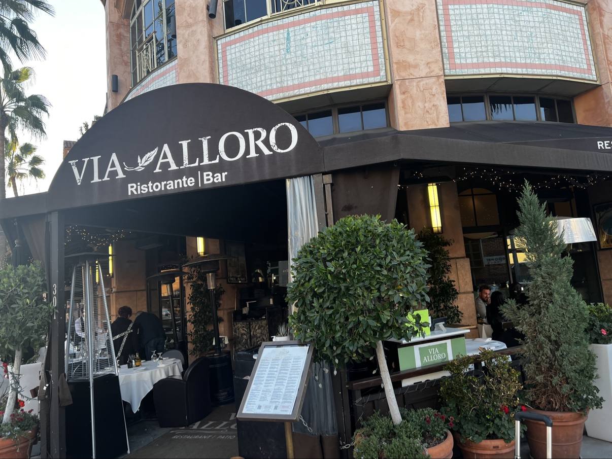 Via Alloro Ristorante and Bar beneath its sweeping black evening awning