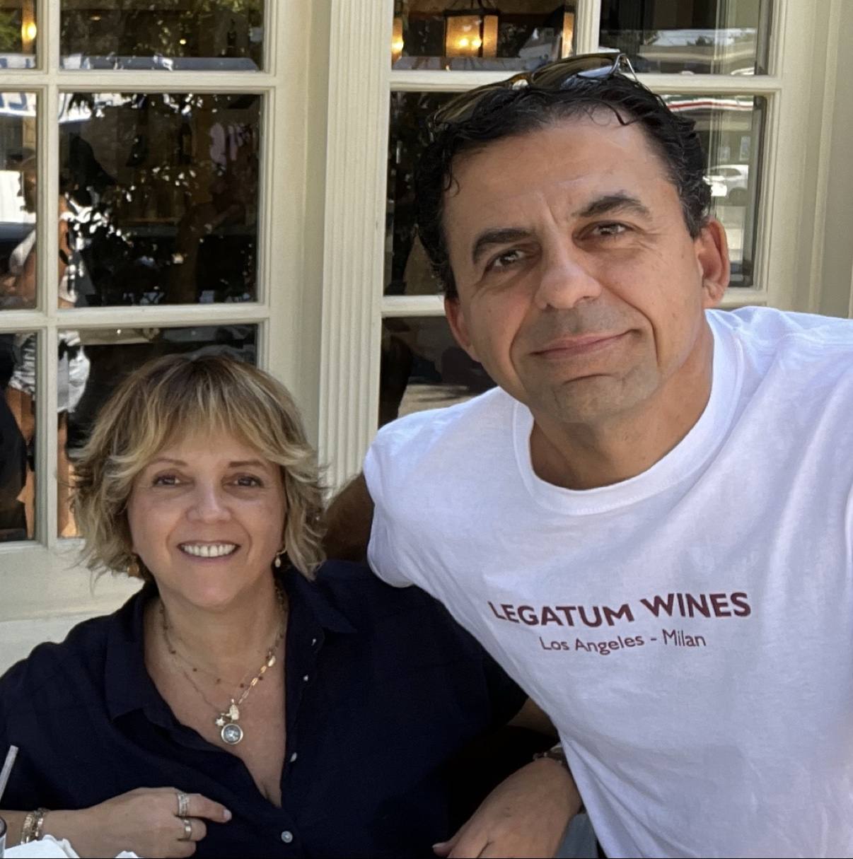 Guillermo Seta and his wife together, with Guillermo wearing his Legatum Wines Los Angeles–Milan shirt